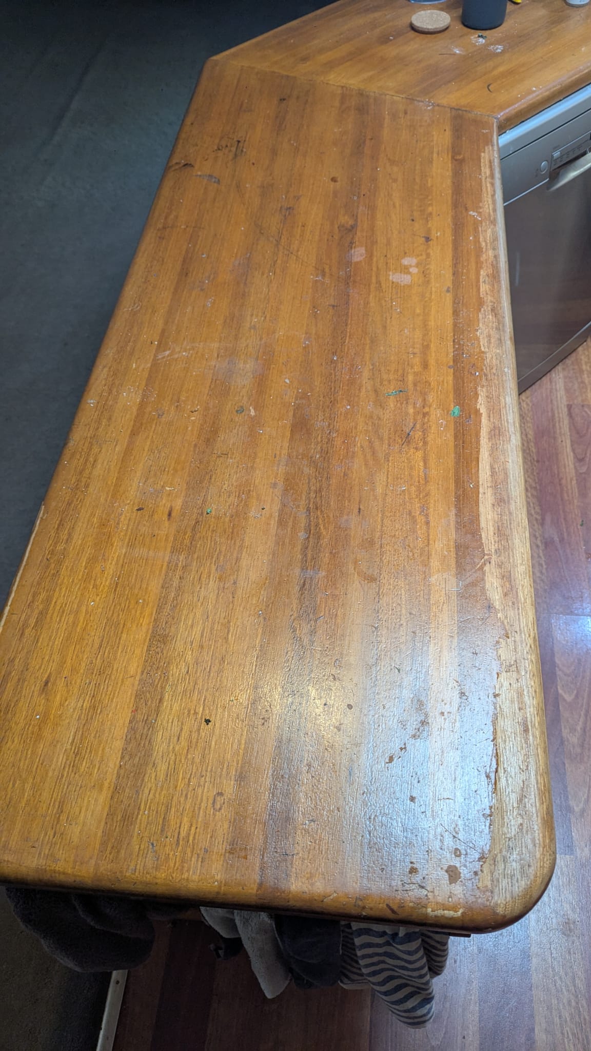 Worn kitchen benchtop before restaining North Brisbane general repairs handyman